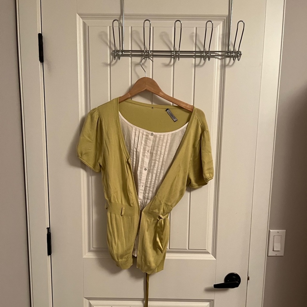 Sweater material blouse. Green in color made by Carroll